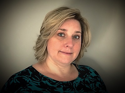 a person with blonde hair and a black shirt