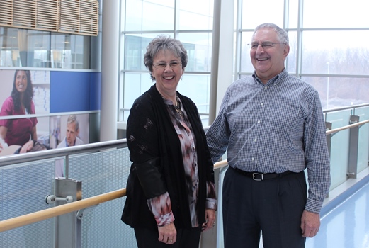 two people standing in a large room