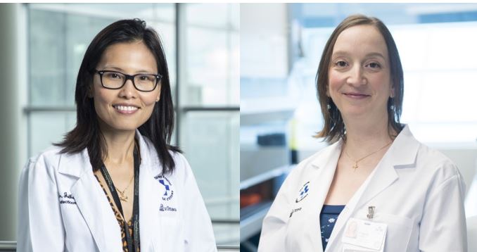 two people in lab coats