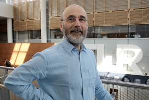 a person standing with their hands on their hips