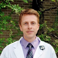 a person wearing a white lab coat