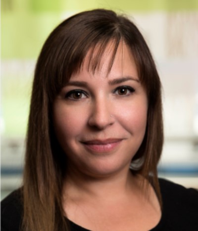 a person with long hair and a black shirt