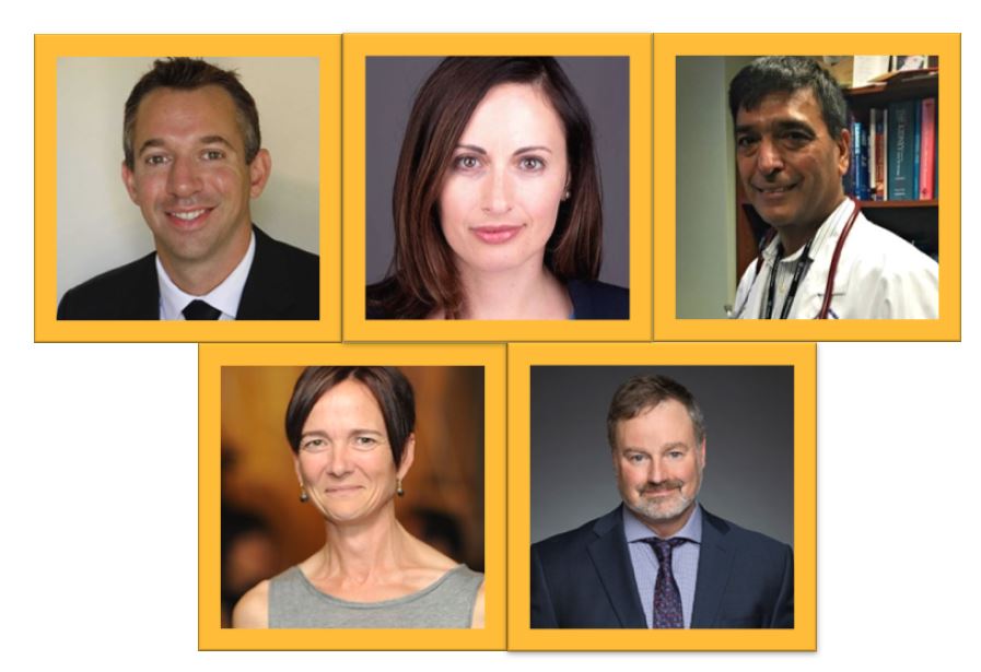 four people are smiling and posing for a photo