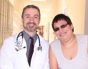 two people in a hospital hallway