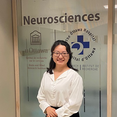 a person standing in front of a glass door