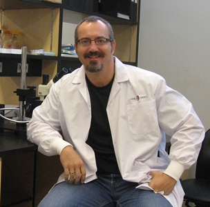 a person sitting in a chair in a lab