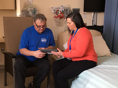 two people in a hospital room