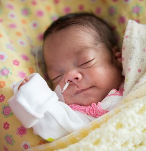 a baby is sleeping in a blanket