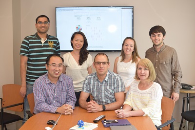 a group of people sitting around a table
