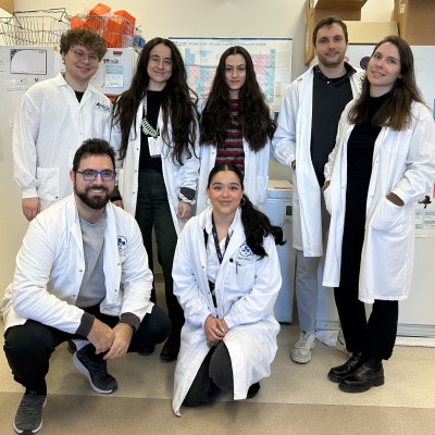 a group of students in white lab coats