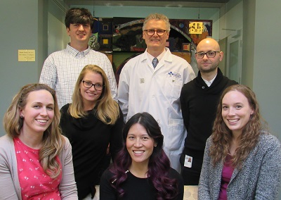 a group of people standing in a room