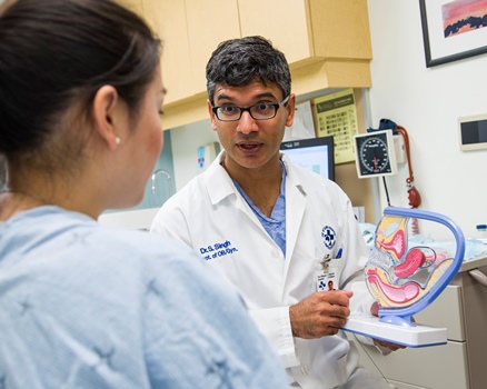 two people in a hospital exam room