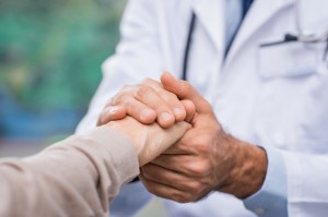 a doctor shaking hands with a patient