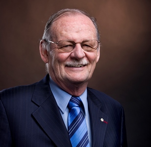 a person in a suit and tie smiling