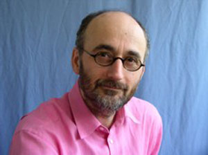 a person in a pink shirt and glasses