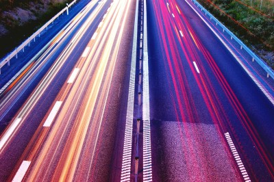 a highway with light trails on it