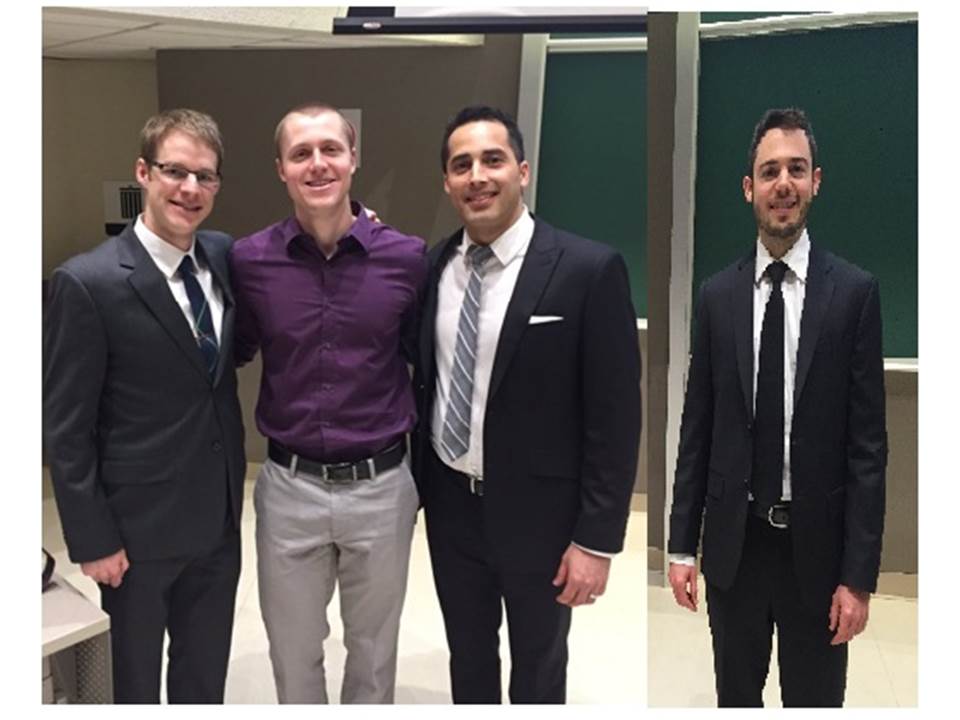 group picture of four people in a professional setting