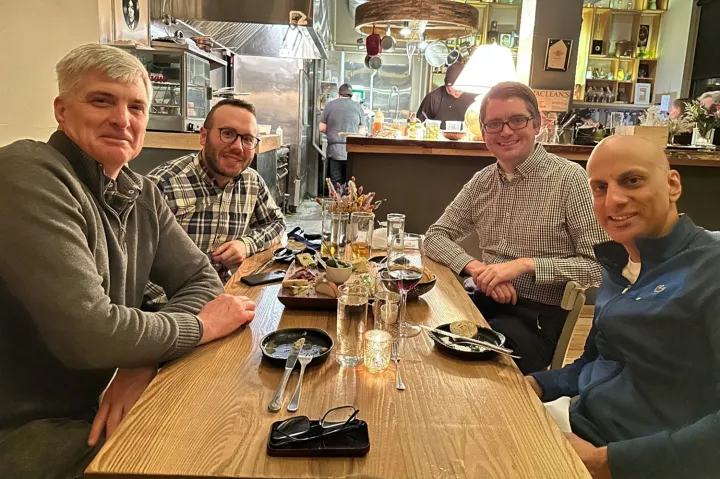 Members of the Blueprint team sitting at a table in a restaurant