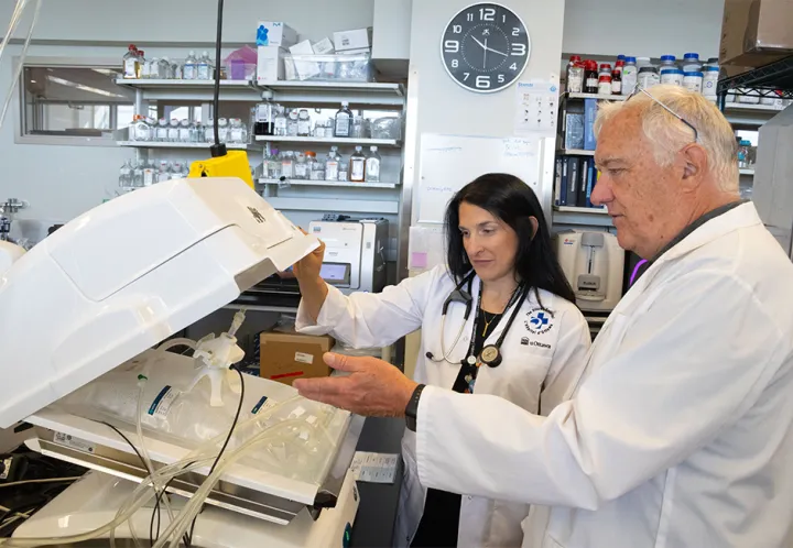 Clinicians and scientists work side by side in a lab to develop new cancer therapies