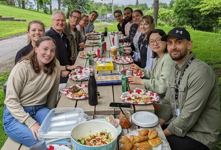People sitting at a picnic table