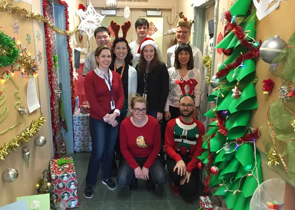People dressed festively posing for a photo