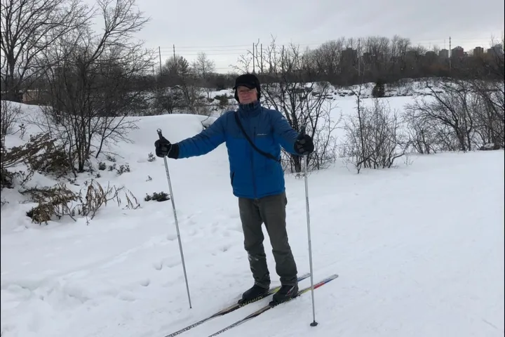 A man on skis in a snowy field