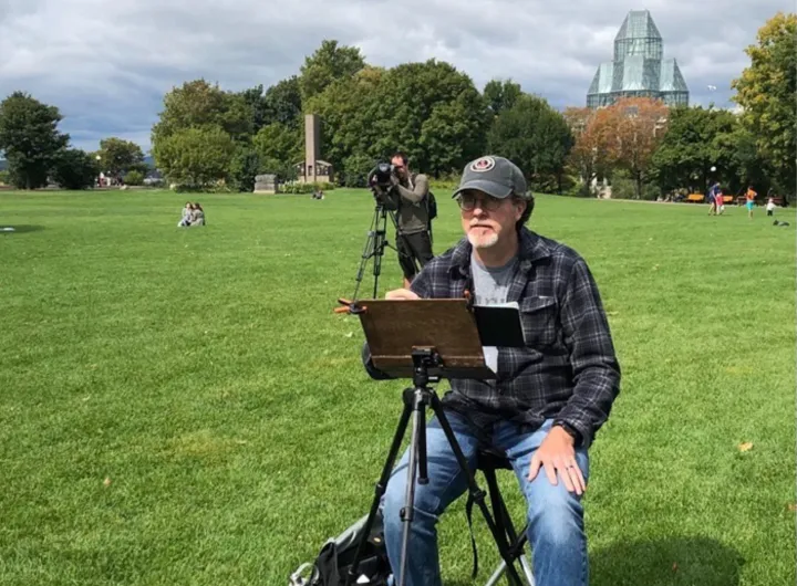 Man painting in a park