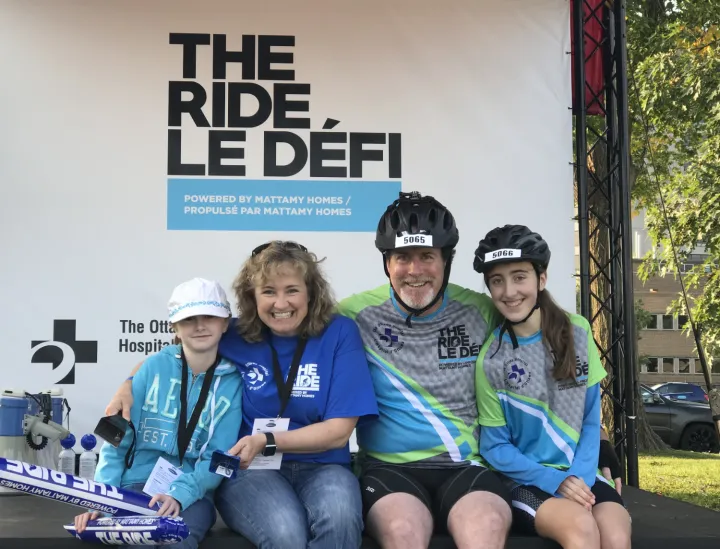 Family in sports gear smiling