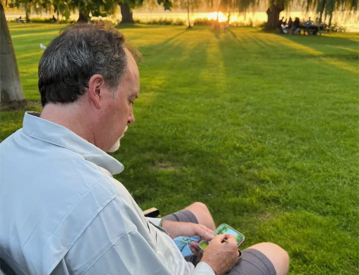 Man painting on a park bench