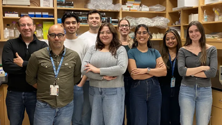 Researchers stand in a lab