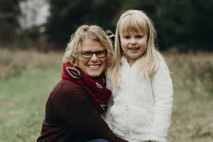 A woman and a young girl in a field