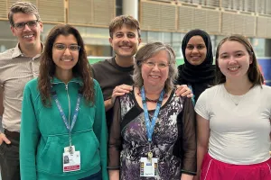 Researchers stand in a hospital hallway
