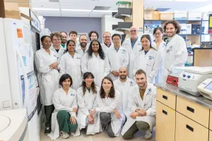A group of people in a lab, posing for a photo