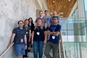 A group of people stand on stairs