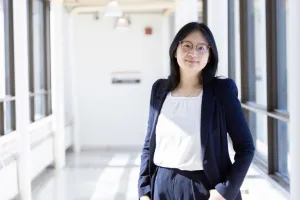 Woman stands in a hallway