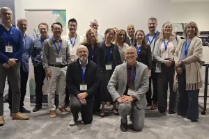 Group of people posing at a conference