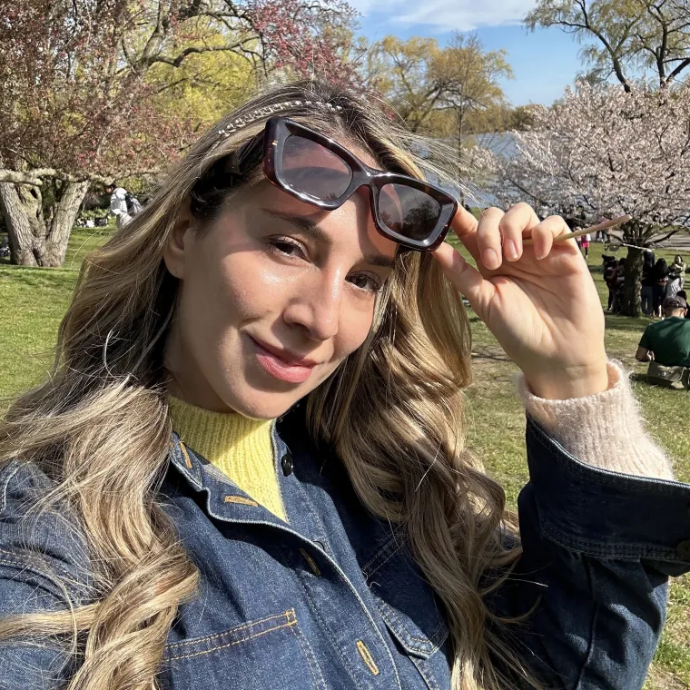 Admiring cherry blossoms in Hide Park (Toronto) in my first year living in Canada