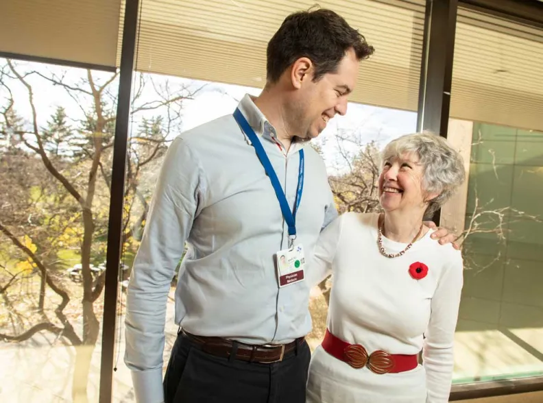 Dr. Guillaume Martel and Phyllis Holmes embrace at The Ottawa Hospital